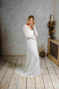 Load image into Gallery viewer, model wearing a modern bohemian lace wedding dress with sleeves