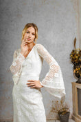 Load image into Gallery viewer, model wearing a modern bohemian lace wedding dress with bell sleeves