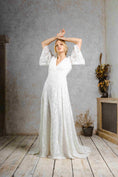 Load image into Gallery viewer, model wearing a modern bohemian lace wedding dress with bell sleeves