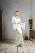 Load image into Gallery viewer, model wearing a modern bohemian lace wedding dress with bell sleeves