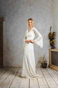 Load image into Gallery viewer, model wearing a modern bohemian lace wedding dress with bell sleeves