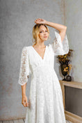 Load image into Gallery viewer, model wearing a modern bohemian lace wedding dress with bell sleeves