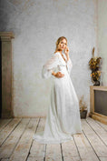 Load image into Gallery viewer, model wearing an outdoors wedding dress with sleeves
