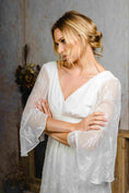 Load image into Gallery viewer, model wearing an outdoors wedding dress with sleeves