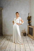 Load image into Gallery viewer, A model wearing a vintage-inspired wedding dress.