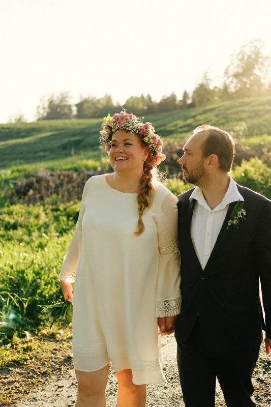 bride and groom walking on a country road