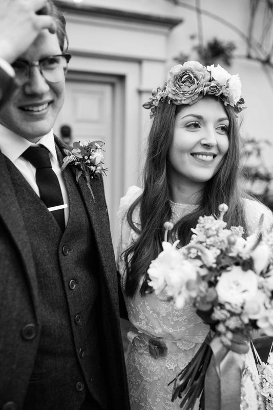 bride and groom right after getting married in a black and white image