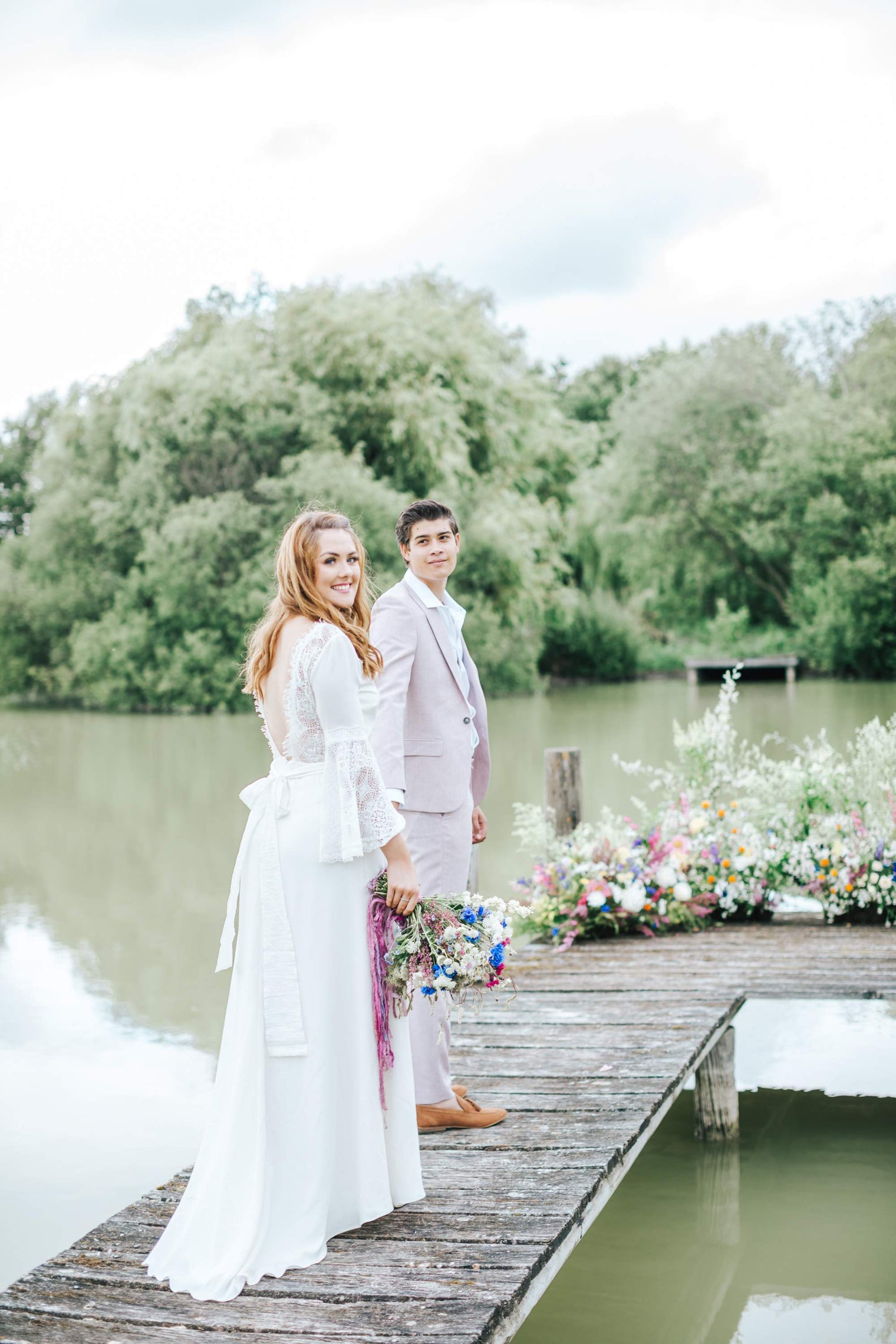 outdoors wedding bride and groom on a pier 