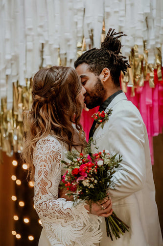 Disco wedding bride and groom kissing