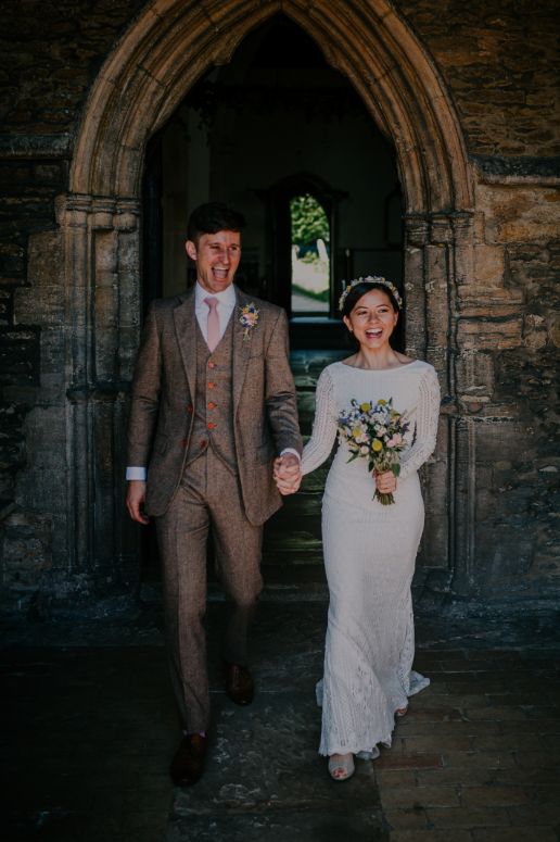 bride and groom walking hand in hand