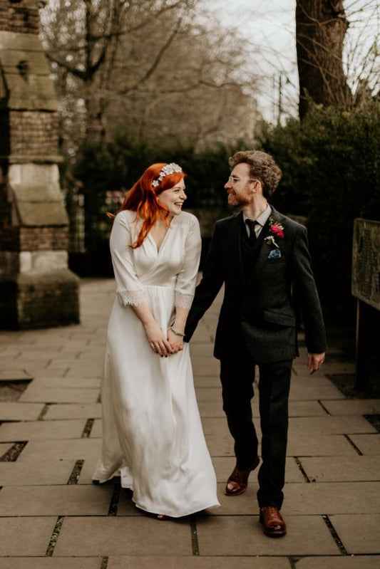 bride and groom walking hand in hand