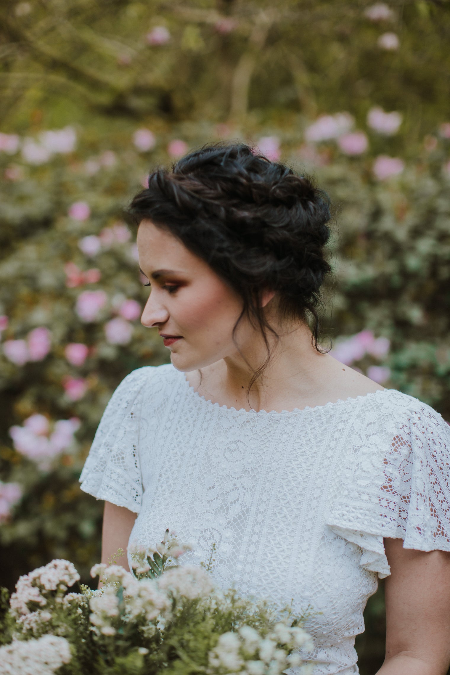 bride wearing a handmade wedding dress and bridal bouquet