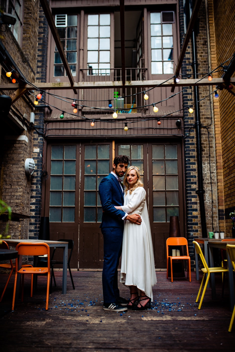 bride and groom embracing during their London pub wedding