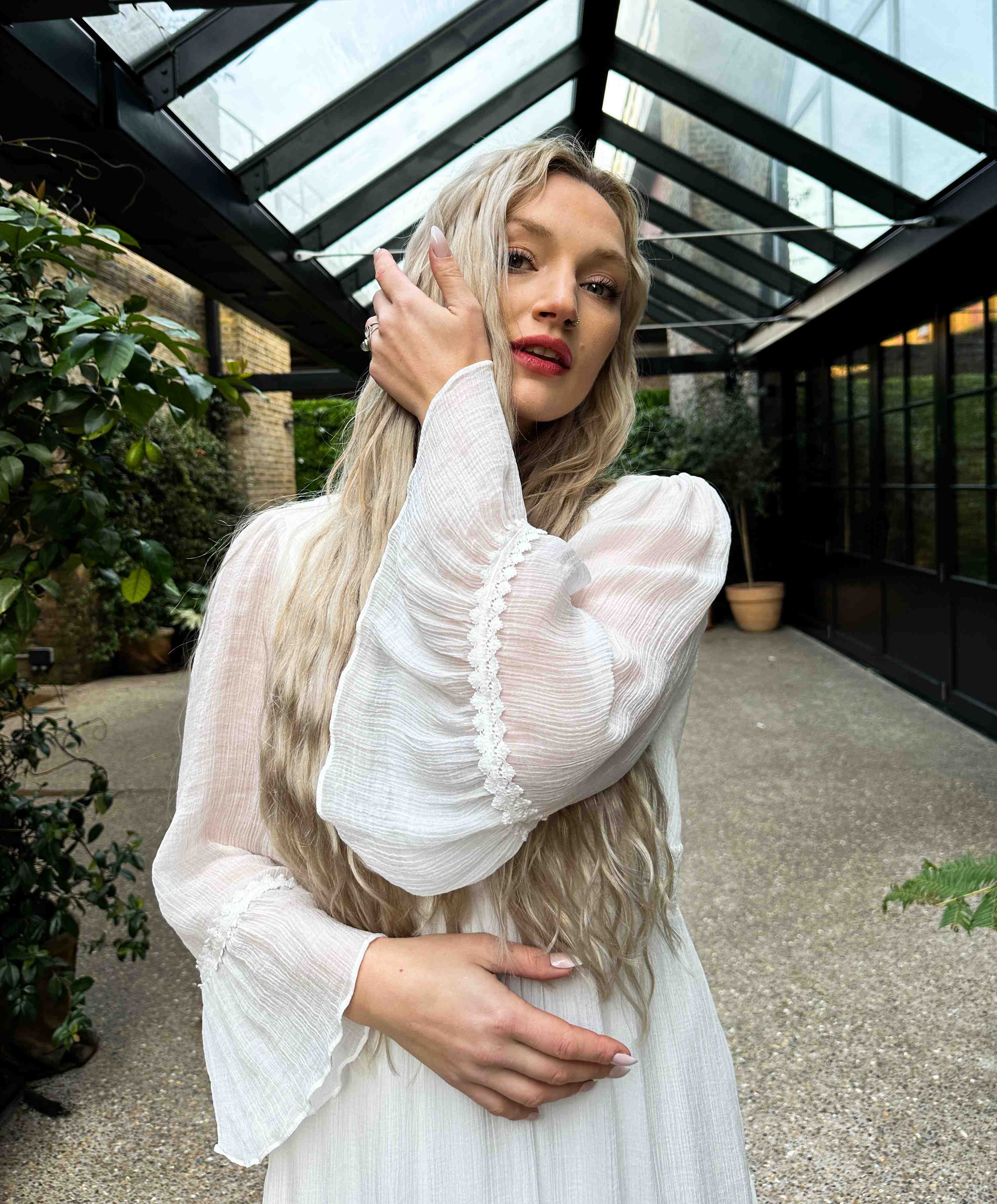 A model wearing a modern bohemian vegan wedding dress.