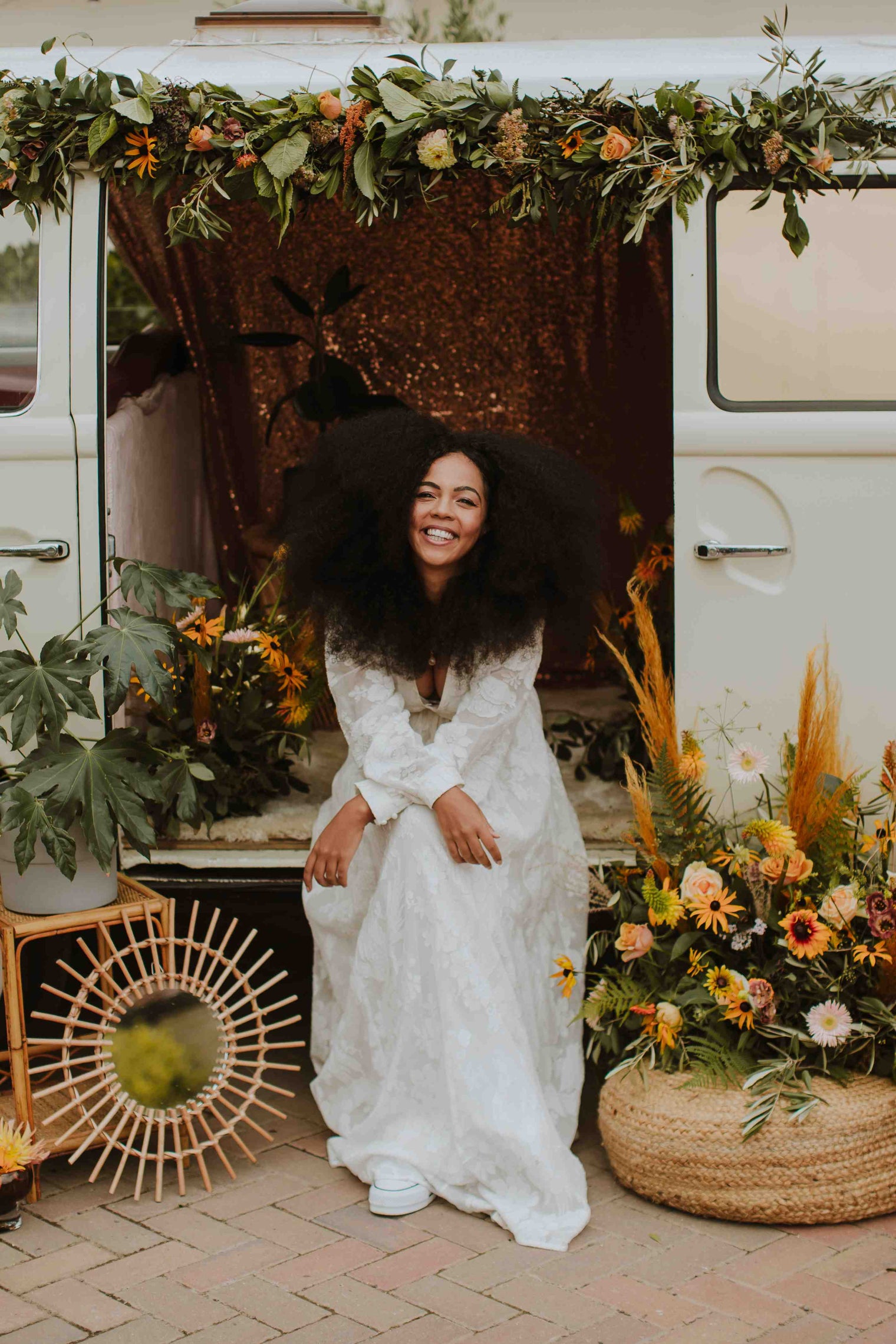 retro wedding boho bride sitting in a camper van