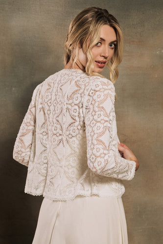 model wearing a bridal lace jacket