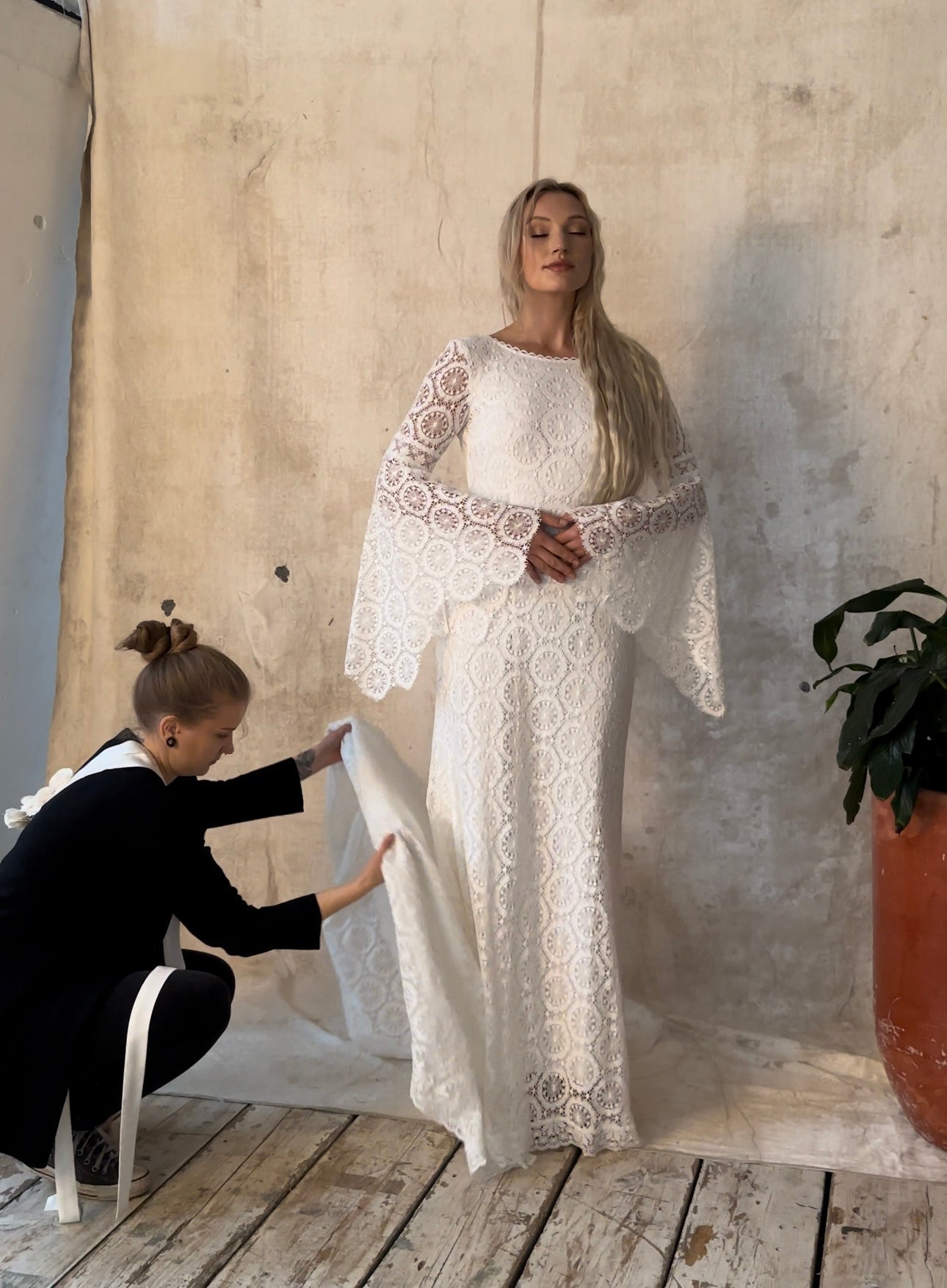 bridal wear designer and model at a photoshoot