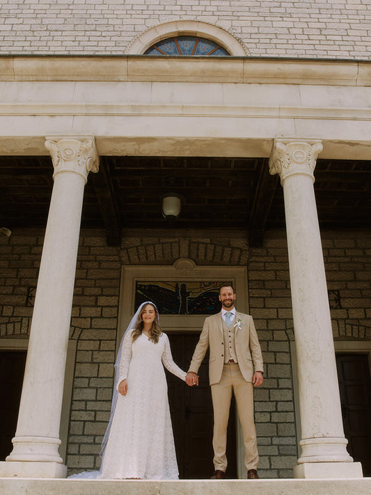 bride and groom coming down stairs