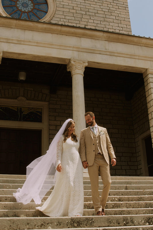 bride and groom coming down stairs