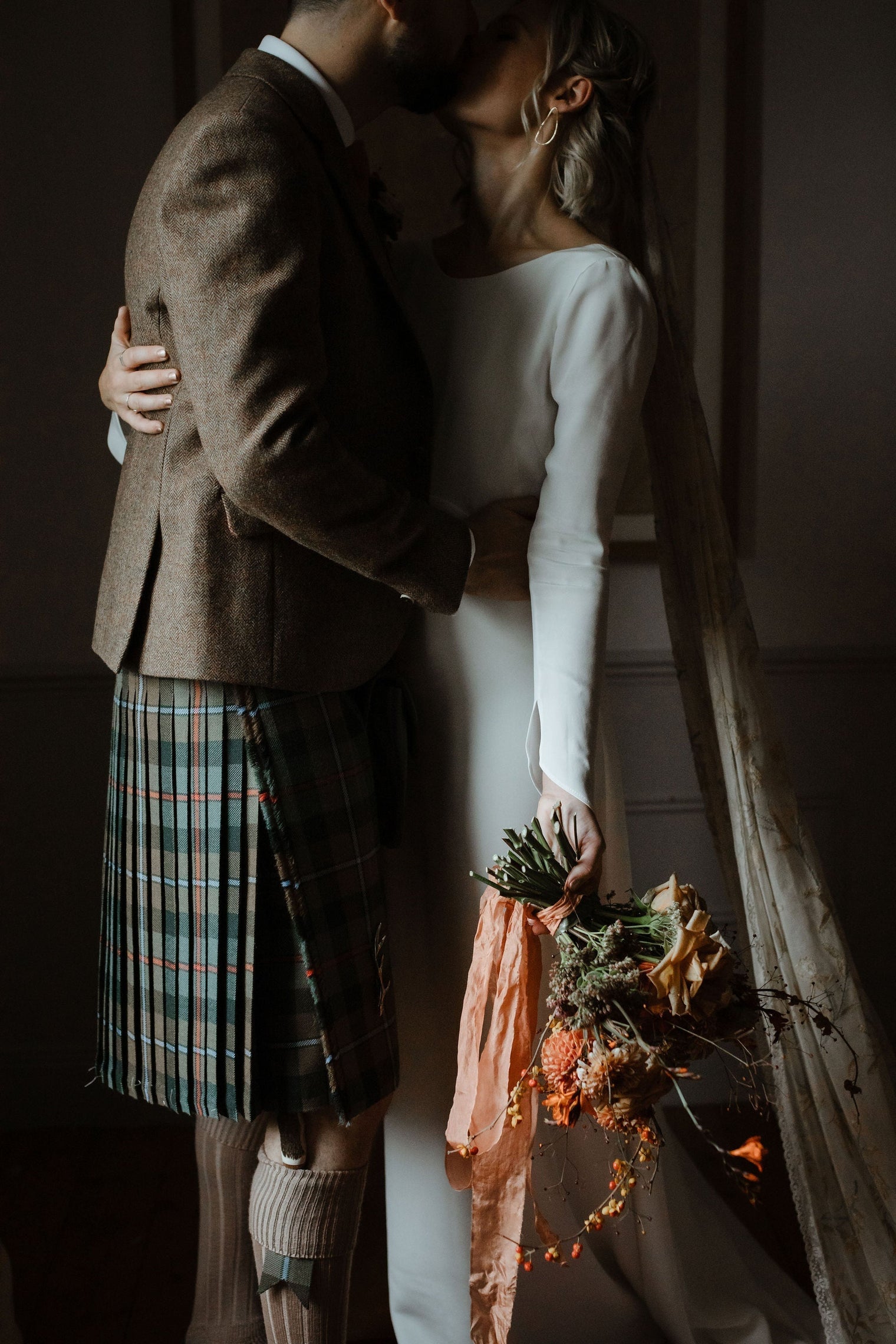 scottish bride and groom holding each other