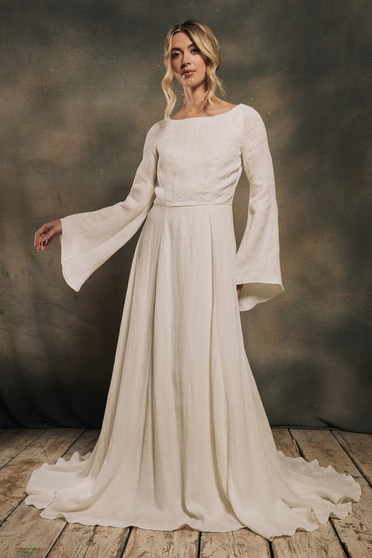 modern bohemian wedding dress with bell sleeves