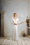 Load image into Gallery viewer, model wearing an outdoors wedding dress with sleeves
