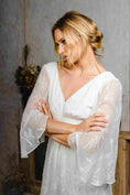 Load image into Gallery viewer, model wearing an outdoors wedding dress with sleeves
