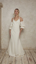 Load and play video in Gallery viewer, model wearing a linen wedding dress with detachable sleeves
