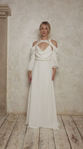 Load and play video in Gallery viewer, model wearing a wedding dress with a cowl neckline and billowy sleeves
