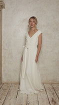 Load and play video in Gallery viewer, model wearing a linen wedding dress with off-the-shoulder style cap sleeves
