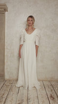 Load and play video in Gallery viewer, model wearing a linen wedding dress with leg of mutton sleeves
