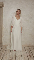 Load and play video in Gallery viewer, model wearing a cotton wedding dress with billowy sleeves
