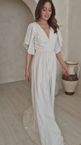 Load and play video in Gallery viewer, A model wearing a modern bohemian wedding dress.
