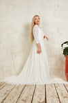 sustainable wedding dress with a lace top and high neckline